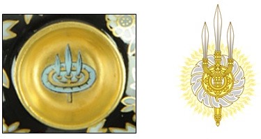 A disc and a trident symbol which form the emblem of the Chakri Dynasty